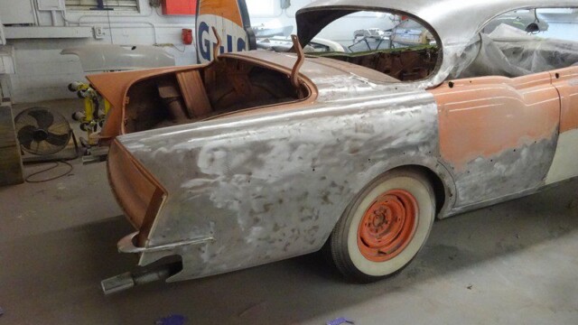 Bare-metal rear quarter with whitewall wheel