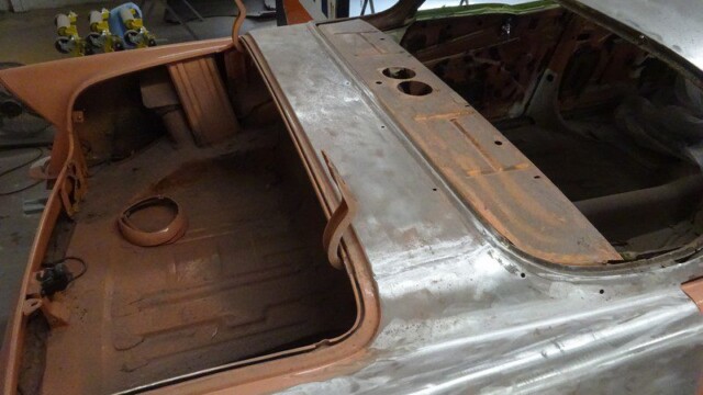 Classic car trunk restoration in progress.