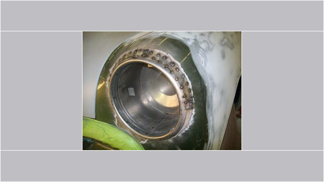 Here's an alt tag for the image: `Classic car headlight restoration in progress.`