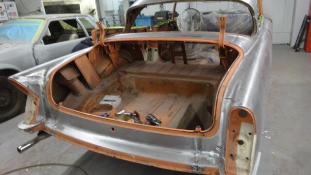 Open rear trunk showing inner bodywork and tools
