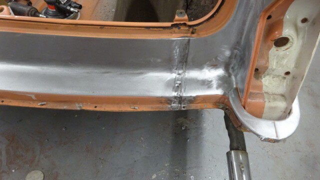 Rear rocker sill welded patch near exhaust
