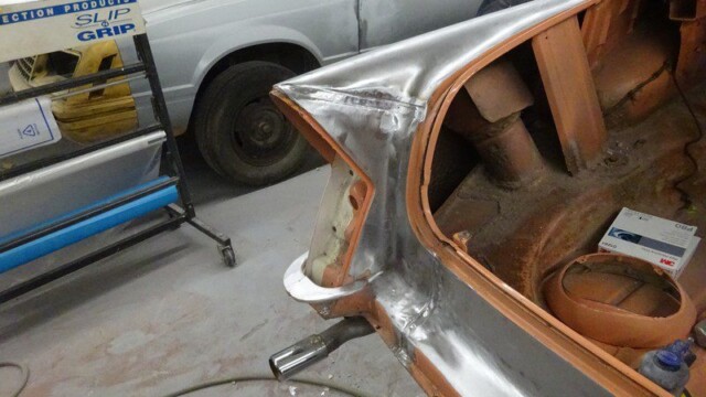 Bare metal quarter panel around trunk opening