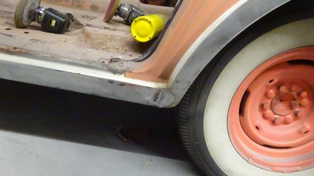 Whitewall wheel and sanded rocker panel