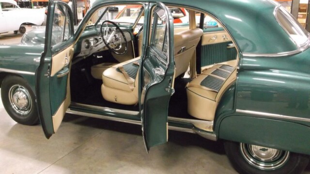 Green classic car interior view.