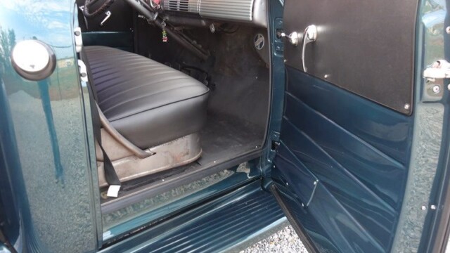 Here's an alt tag for the image: Vintage truck's interior, driver's side.