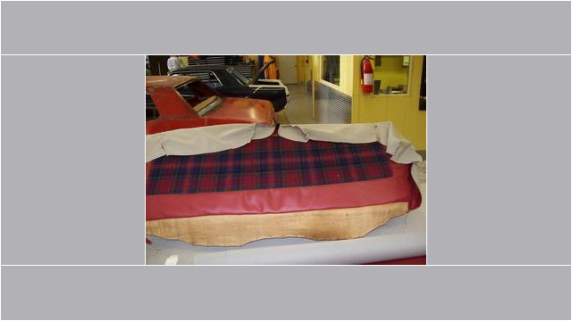 Here's an alt tag for the image: `Classic car seat upholstery detail`