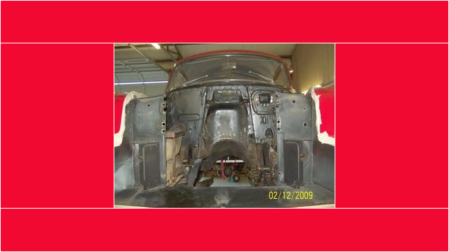 Here's an alt tag for the image: `Classic car engine bay, under restoration`