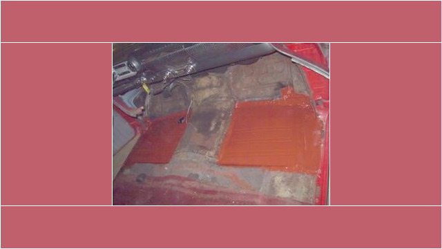 Here's an alt tag for the image: `Classic car floor restoration in progress`