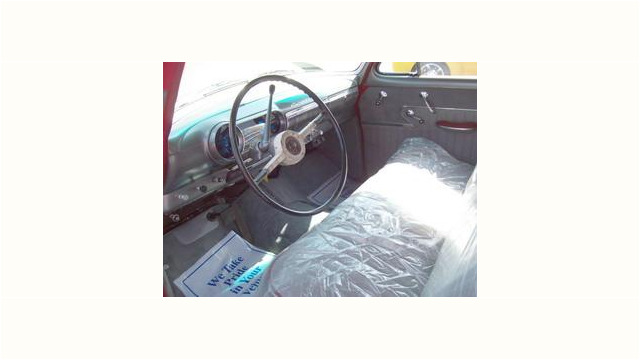 Here's an alt tag for the image: `Classic car interior, vintage vehicle`
