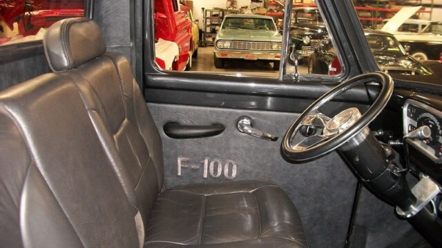 Black leather interior of a classic F-100 truck.