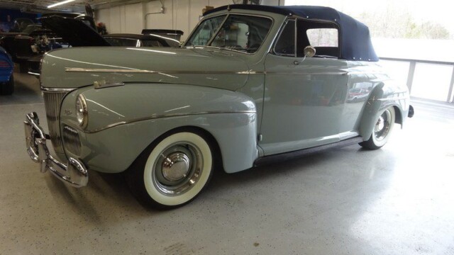Gray 1940s Ford convertible classic car.