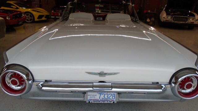 White 1960 Ford Thunderbird convertible.