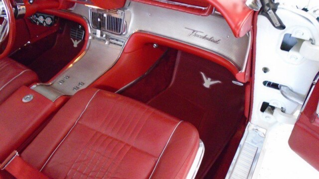 Red interior of a classic Thunderbird.
