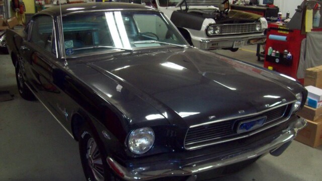 Dark blue Ford Mustang classic car.
