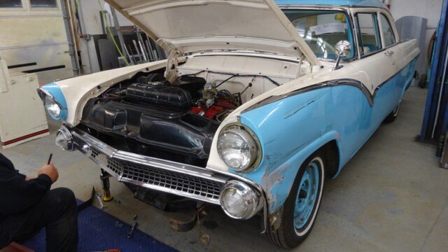 1955 Ford Fairlane under repair.