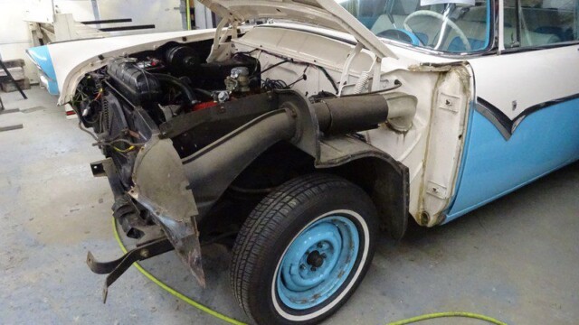 Classic car engine restoration in progress.