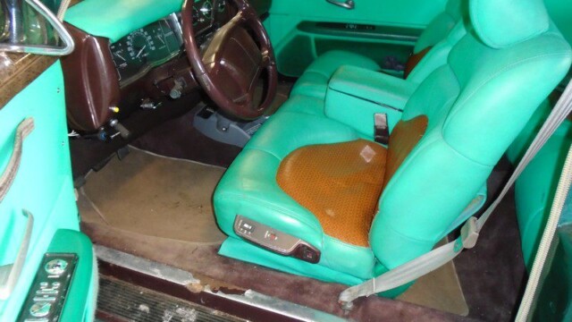 Custom teal car interior, brown accents.