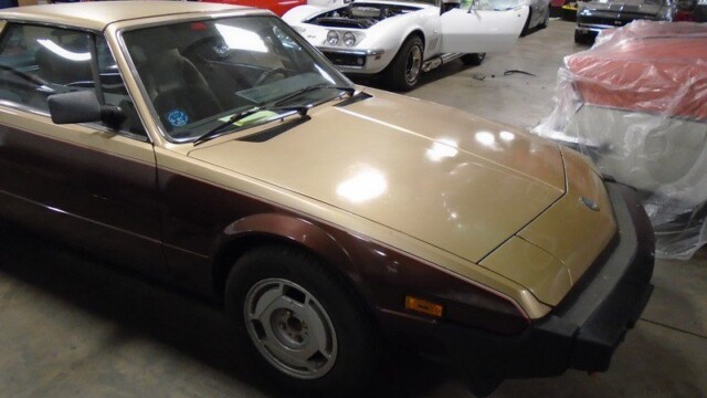 Two-tone brown and beige Fiat X1/9.