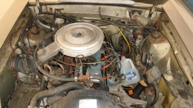 Dirty car engine under the hood.