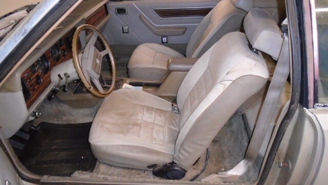 Tan interior of a classic Mustang.
