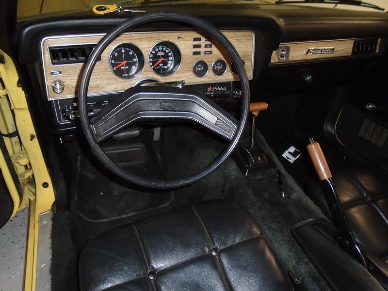 Classic car interior, woodgrain dash.