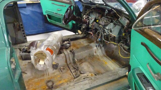 Green car interior under construction.