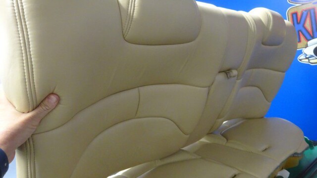 Beige leather car seat backs.