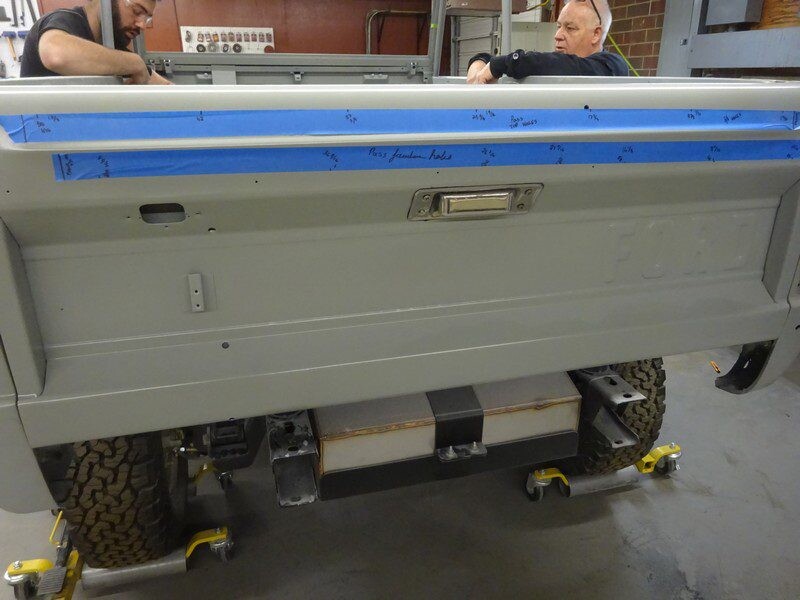 Gray truck tailgate, bodywork in progress.