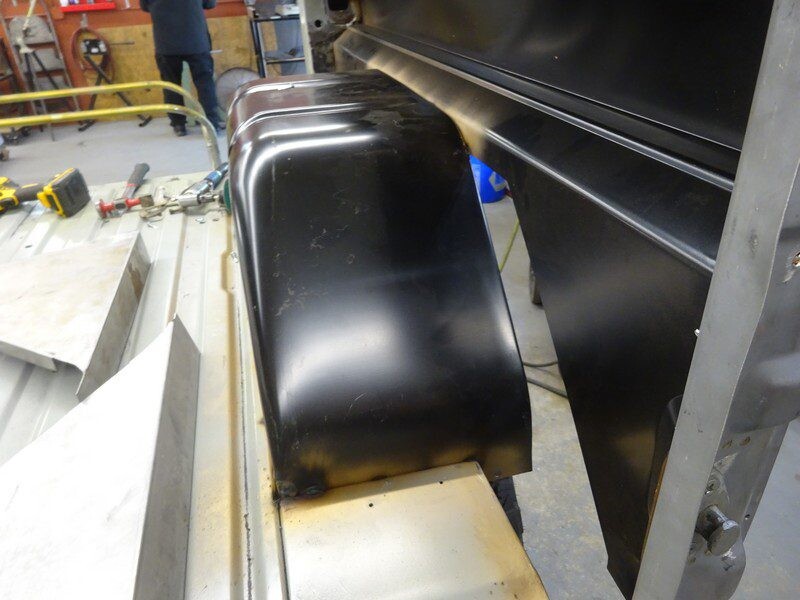 Black metal car body panel fitting.