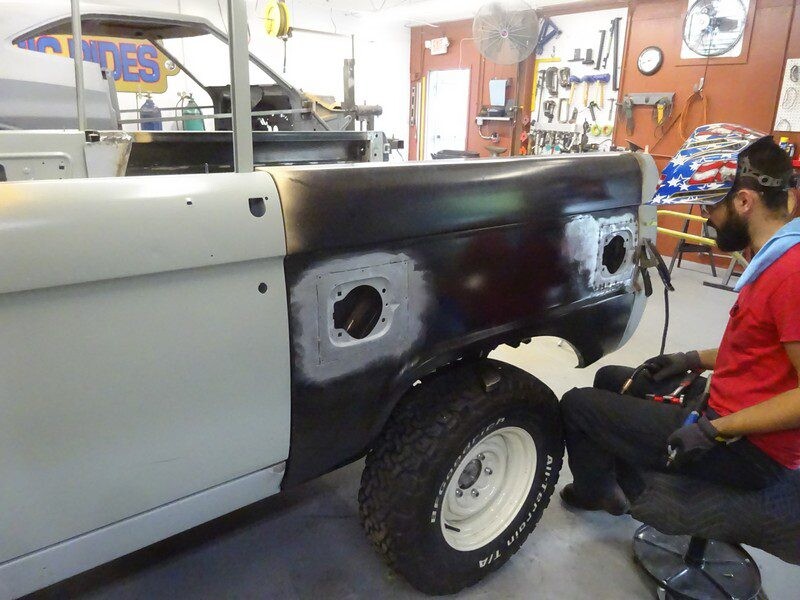 Worker welding rear quarter panel on Bronco