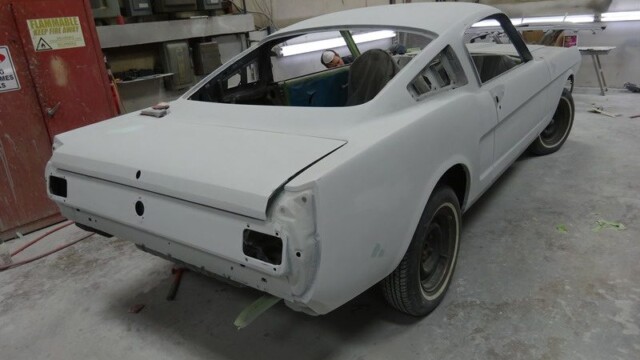 Primered Ford Mustang restoration project.