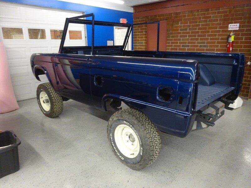 Here's an alt tag for the image: Blue Ford Bronco restoration project.