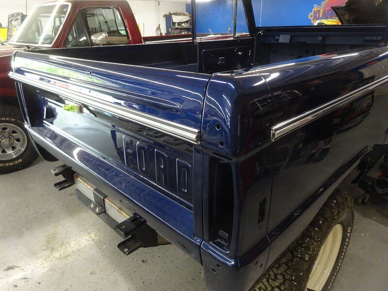 Blue Ford Bronco truck bed detail.