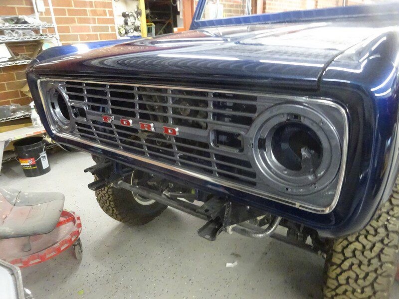 Here's an alt tag for the image: Blue Ford Bronco front grill.