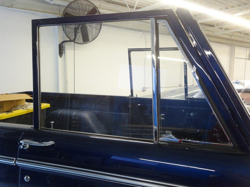 Dark blue Ford Bronco door glass.