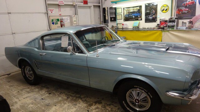Light blue classic Ford Mustang.
