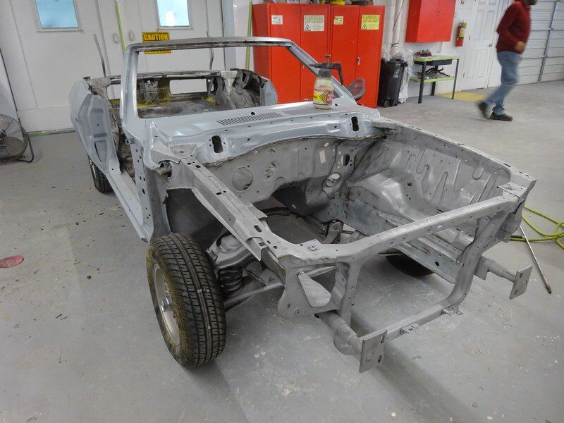 Car body in progress, primered shell.