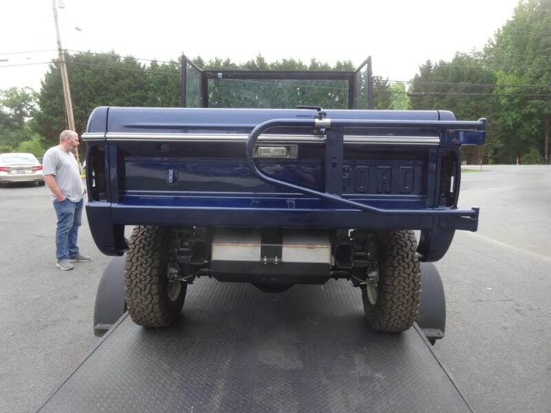 Rear view of a blue Ford Bronco.
