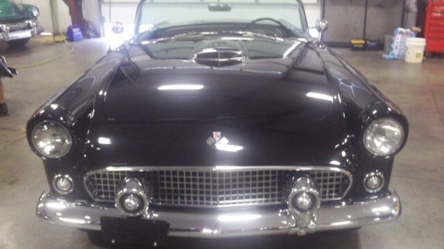 Black classic Ford Thunderbird convertible.