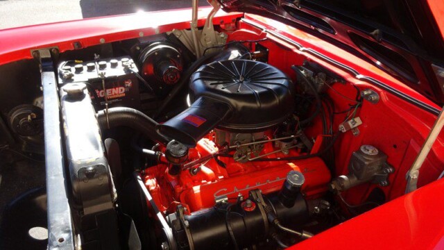 Red classic car engine detail.