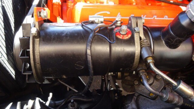 Classic car engine alternator detail.