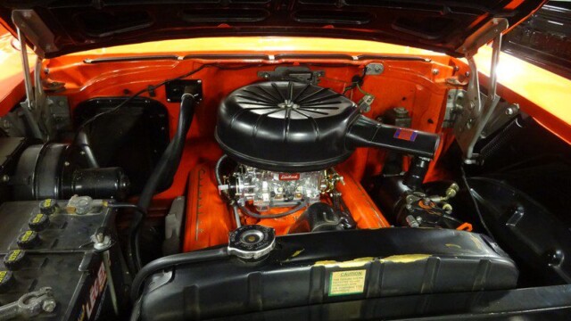 Orange classic car engine bay.