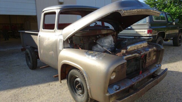 Rusty vintage Ford pickup truck restoration.