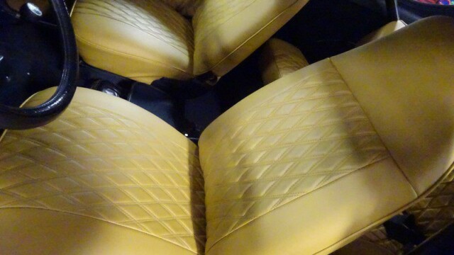 Yellow quilted car seats interior.