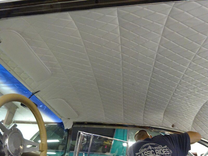 Custom car interior headliner installation.