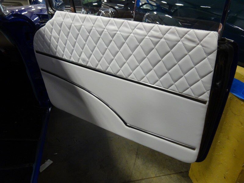 Custom car door panel, white quilted leather.