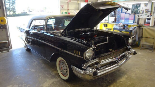 Black 1957 Chevy Bel Air convertible.