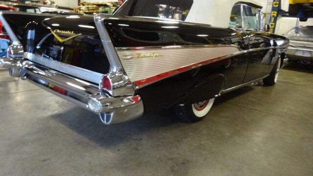 Black 1957 Chevy Bel Air convertible.