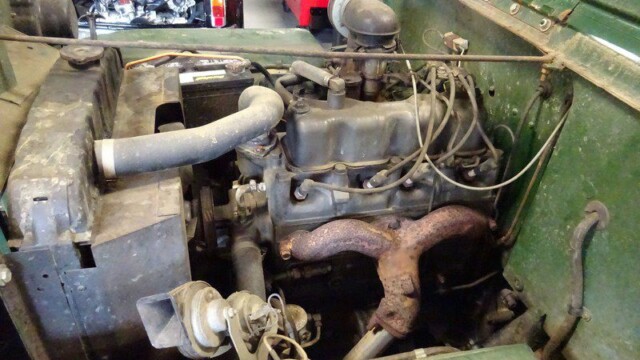 Jeep engine bay, open hood.