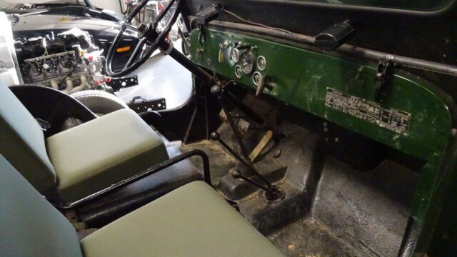 Green Jeep interior, driver's seat.